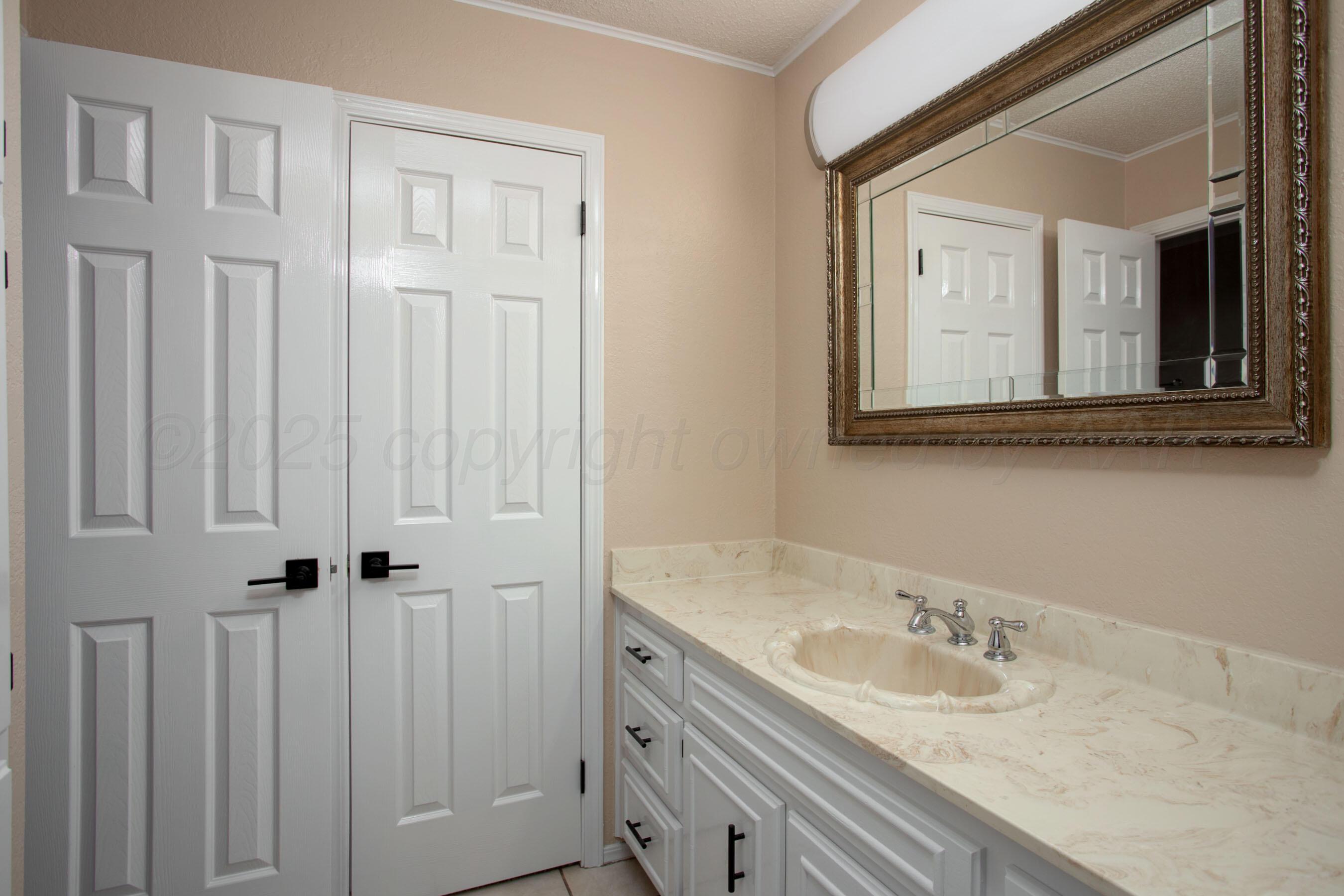 3529 Cinderella Lane Amarillo, TX 79121 - Photo 19 of 33 a bathroom with a sink and vanity