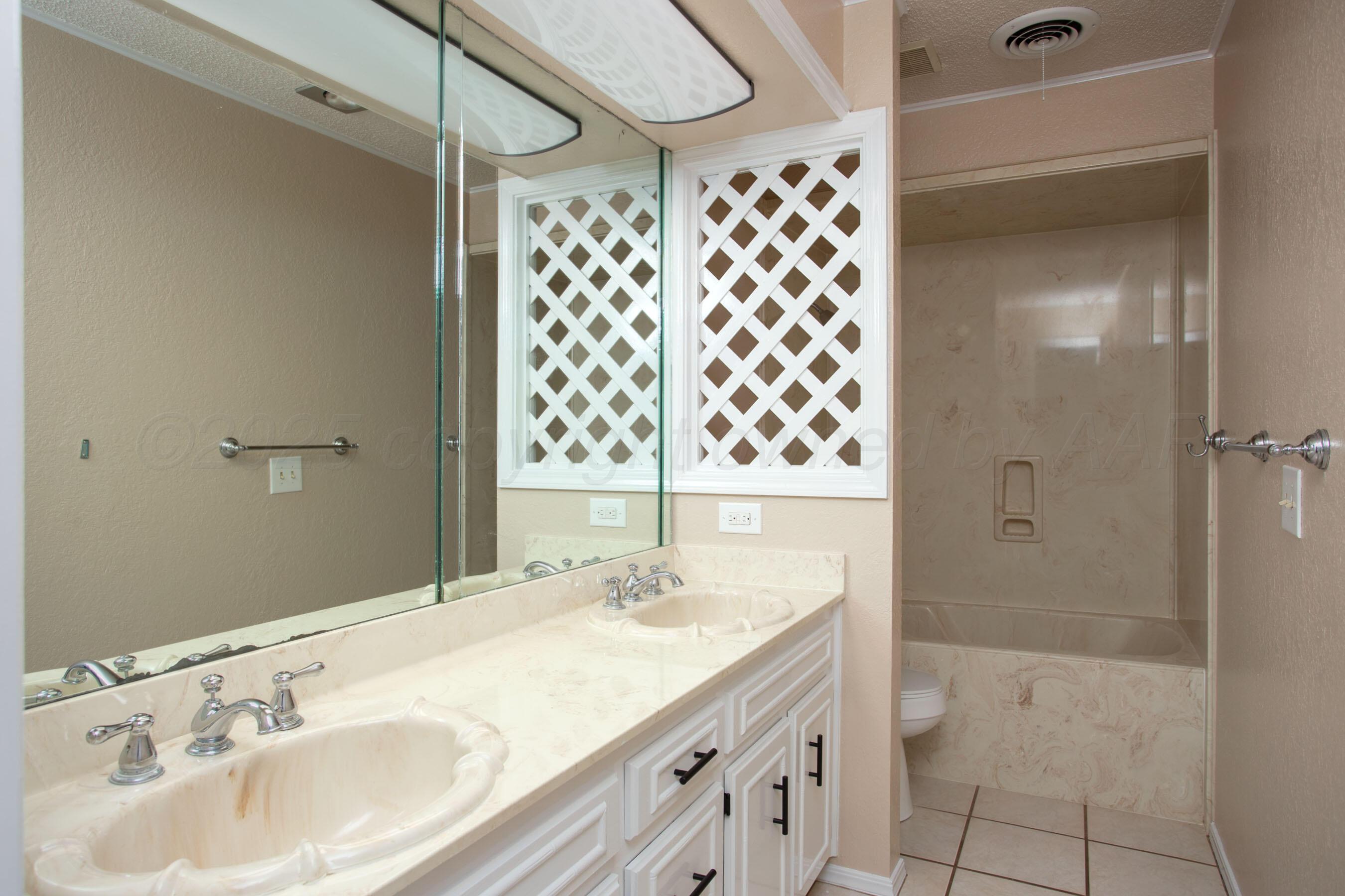 3529 Cinderella Lane Amarillo, TX 79121 - Photo 27 of 33 a bathroom with a sink toilet and shower