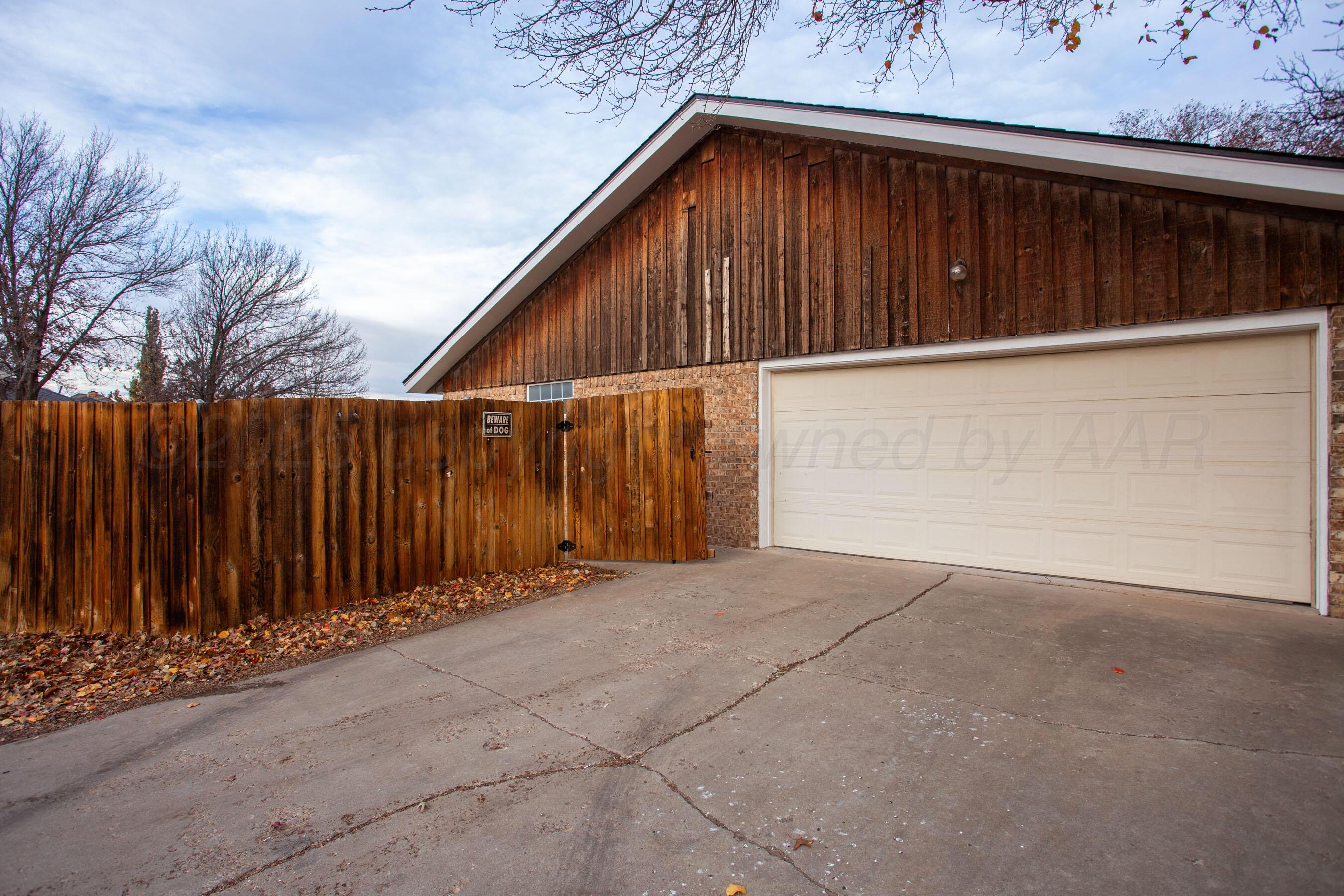 3529 Cinderella Lane Amarillo, TX 79121 - Photo 33 of 33 a view of a house with a wooden fence