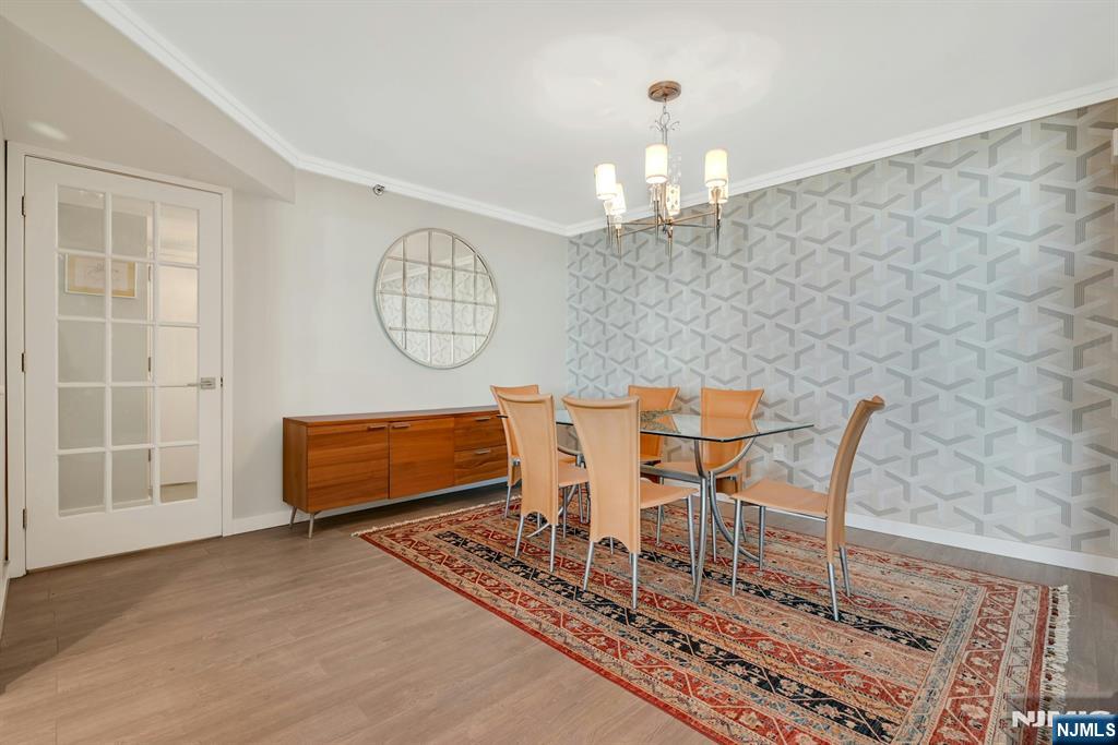 245 Prospect Avenue, Unit 12B Hackensack, NJ 07601 - Photo 13 of 33 a view of a dining room with furniture