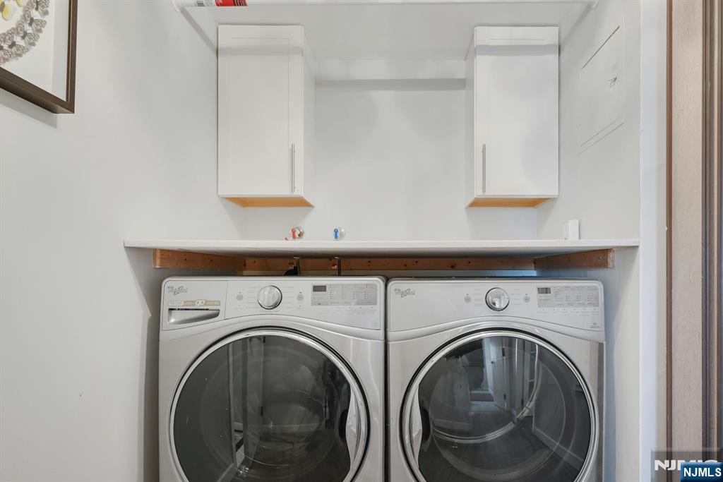 245 Prospect Avenue, Unit 12B Hackensack, NJ 07601 - Photo 24 of 33 a utility room with dryer and washer