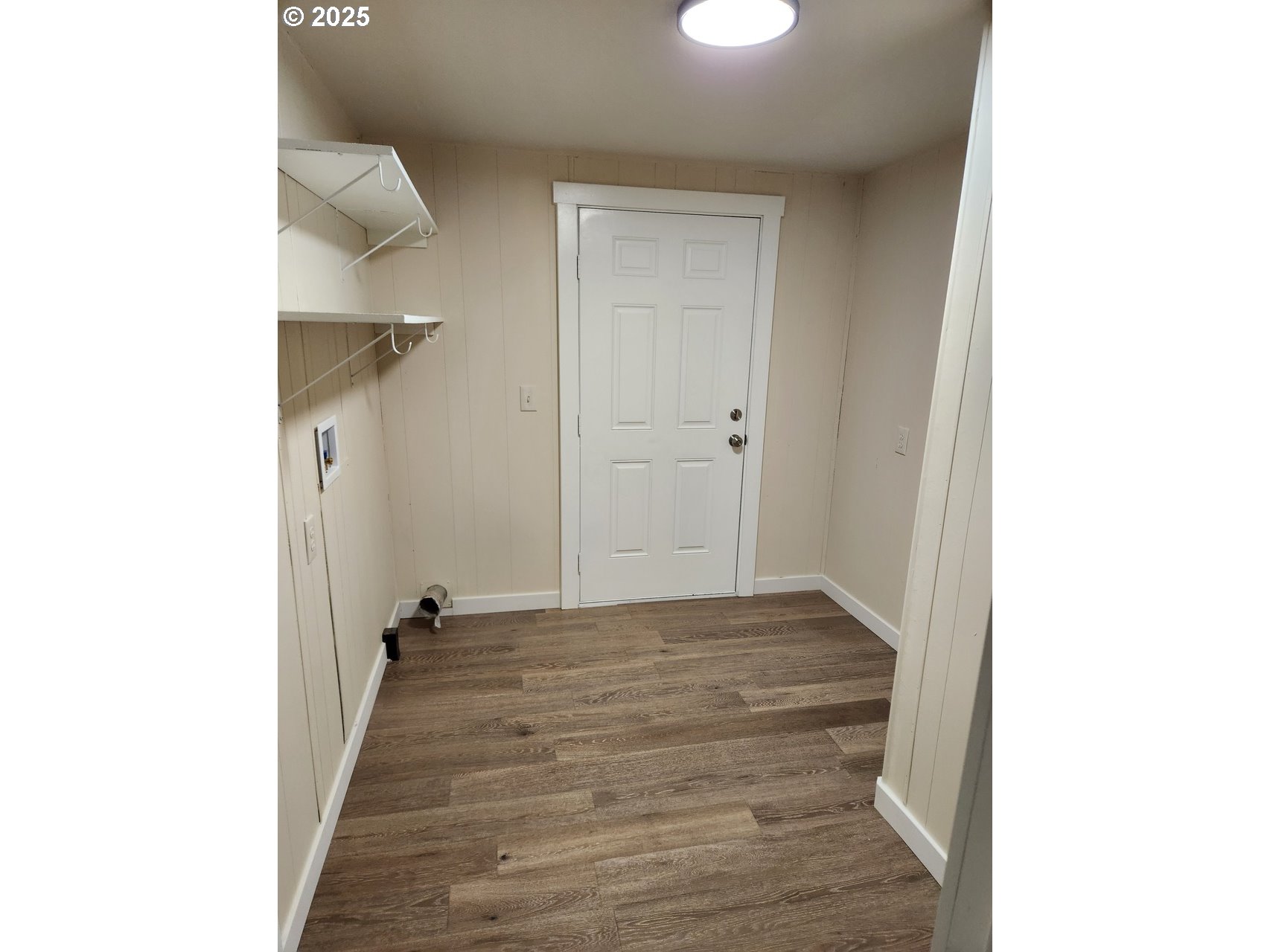 6310 Highway 101, Unit 16 Otis, OR 97368 - Photo 10 of 21 a view of a hallway with wooden floor