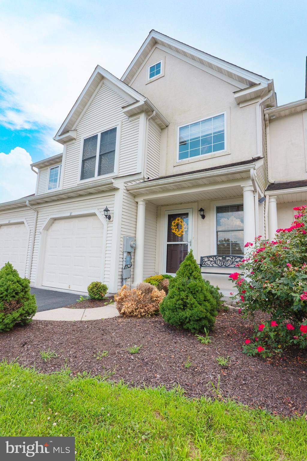 21 White Pine Gulch Reading, PA 19607 - Photo 2 of 35 a front view of a house with a garden and plants