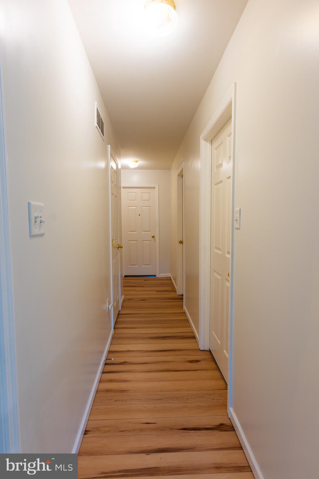 21 White Pine Gulch Reading, PA 19607 - Photo 23 of 35 a view of a hallway with wooden floor and staircase