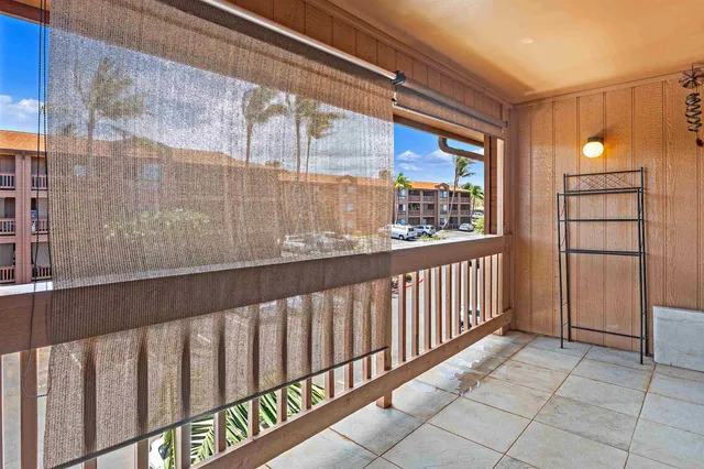 a view of a balcony with wooden floor