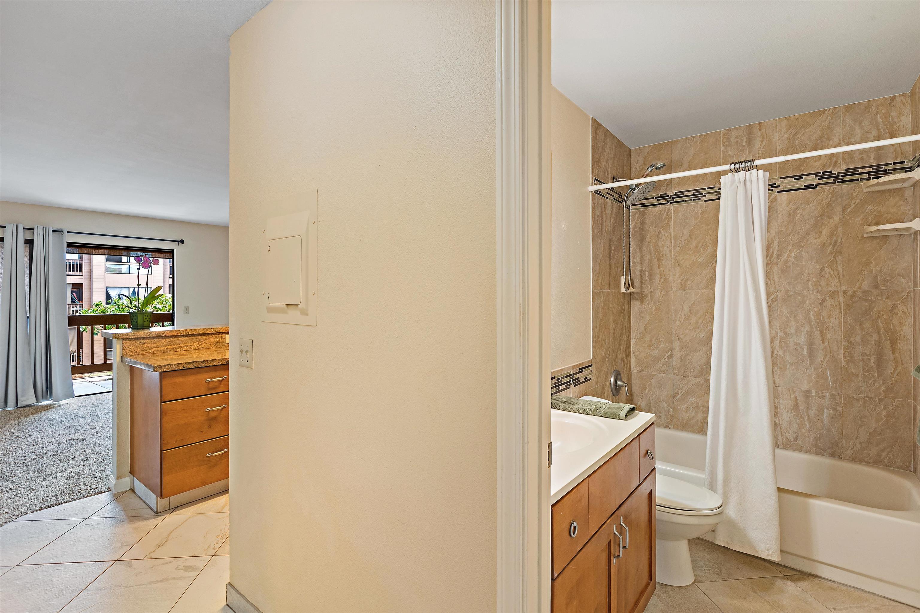 3740 Lower Honoapiilani Road, Unit D305 Lahaina, HI 96761 - Photo 23 of 32 a bathroom with a granite countertop sink toilet and shower