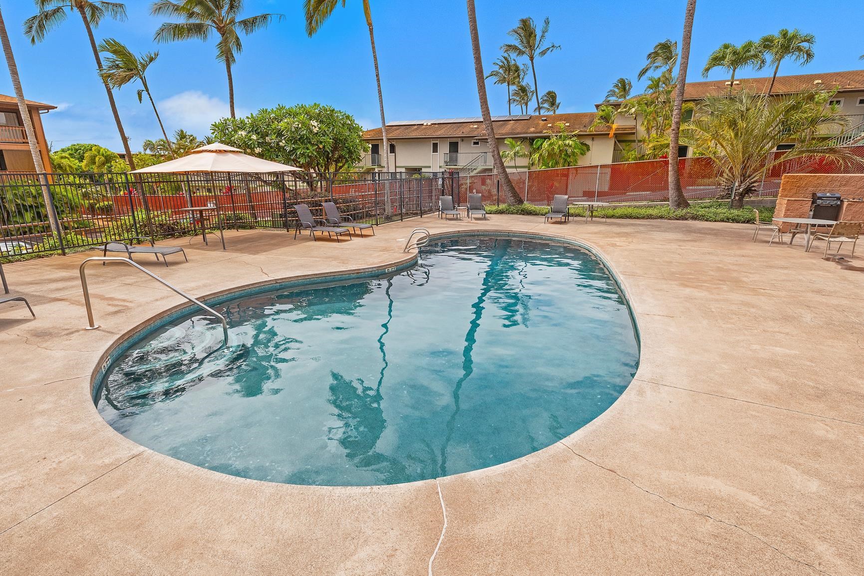 3740 Lower Honoapiilani Road, Unit D305 Lahaina, HI 96761 - Photo 29 of 32 a view of a swimming pool with an outdoor seating