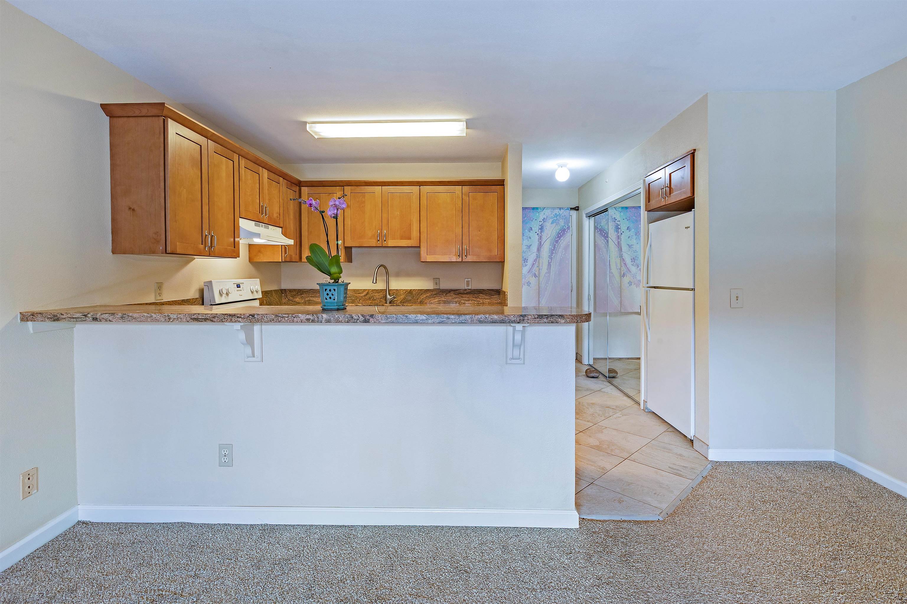 3740 Lower Honoapiilani Road, Unit D305 Lahaina, HI 96761 - Photo 3 of 32 a view of kitchen with wooden floor