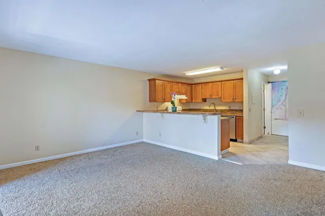 a view of a kitchen with a sink and a window