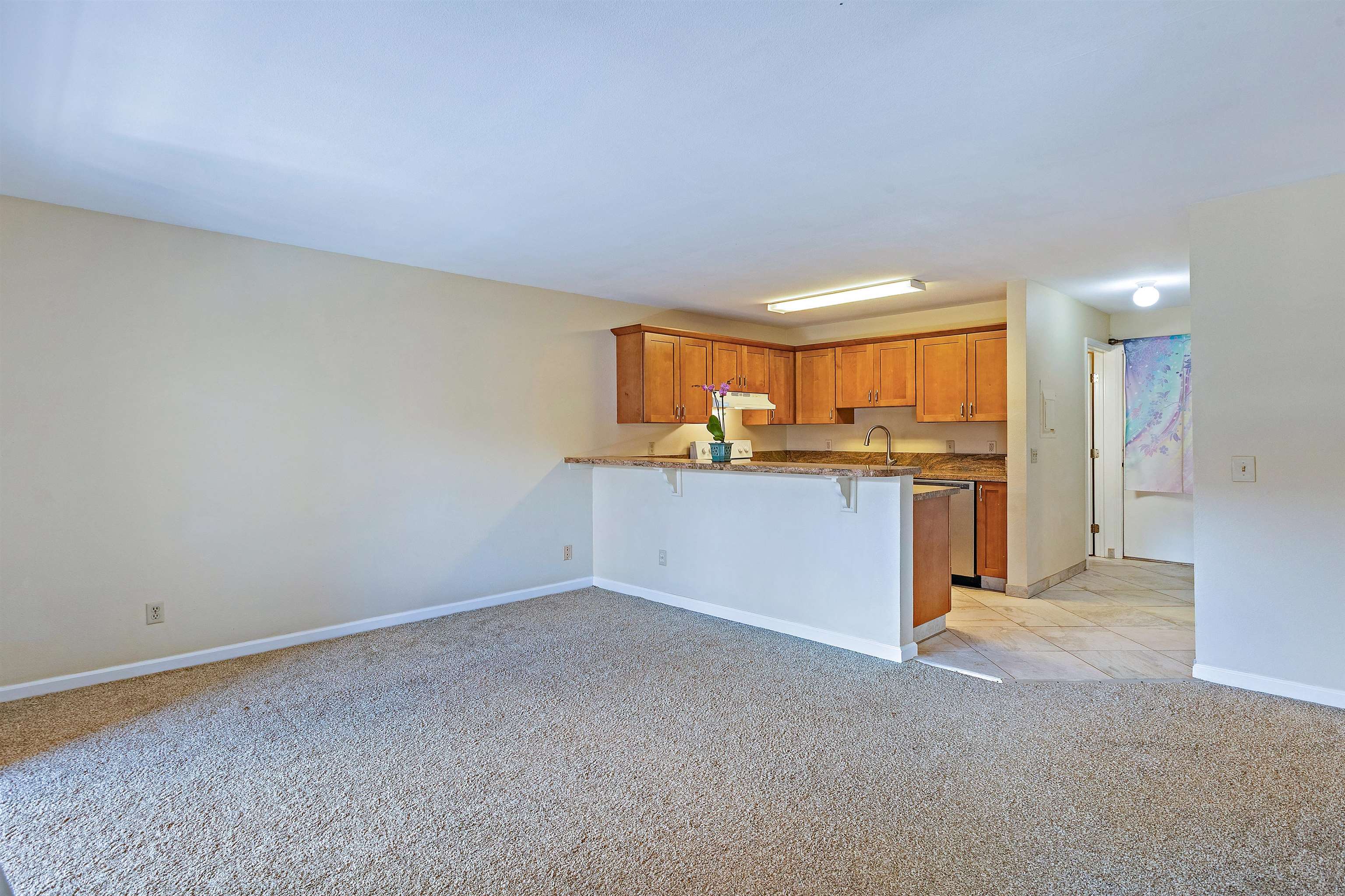 3740 Lower Honoapiilani Road, Unit D305 Lahaina, HI 96761 - Photo 10 of 32 a view of a kitchen with a sink and a window