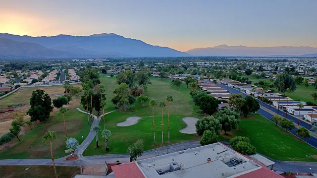 view of a town with mountains in the background