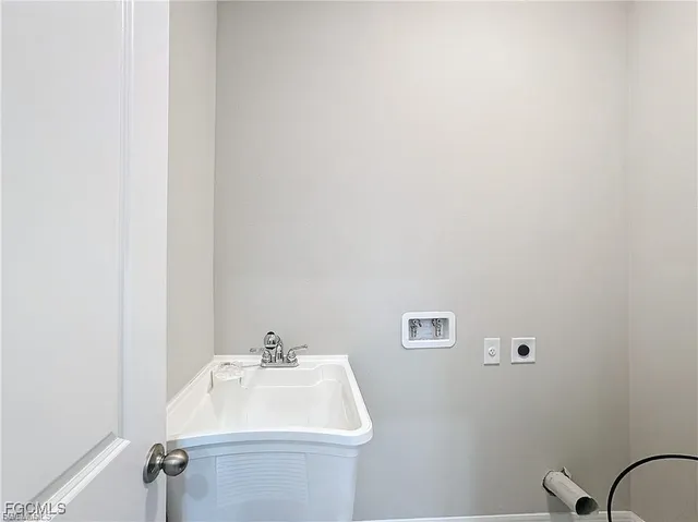 a bathroom with a sink and mirror