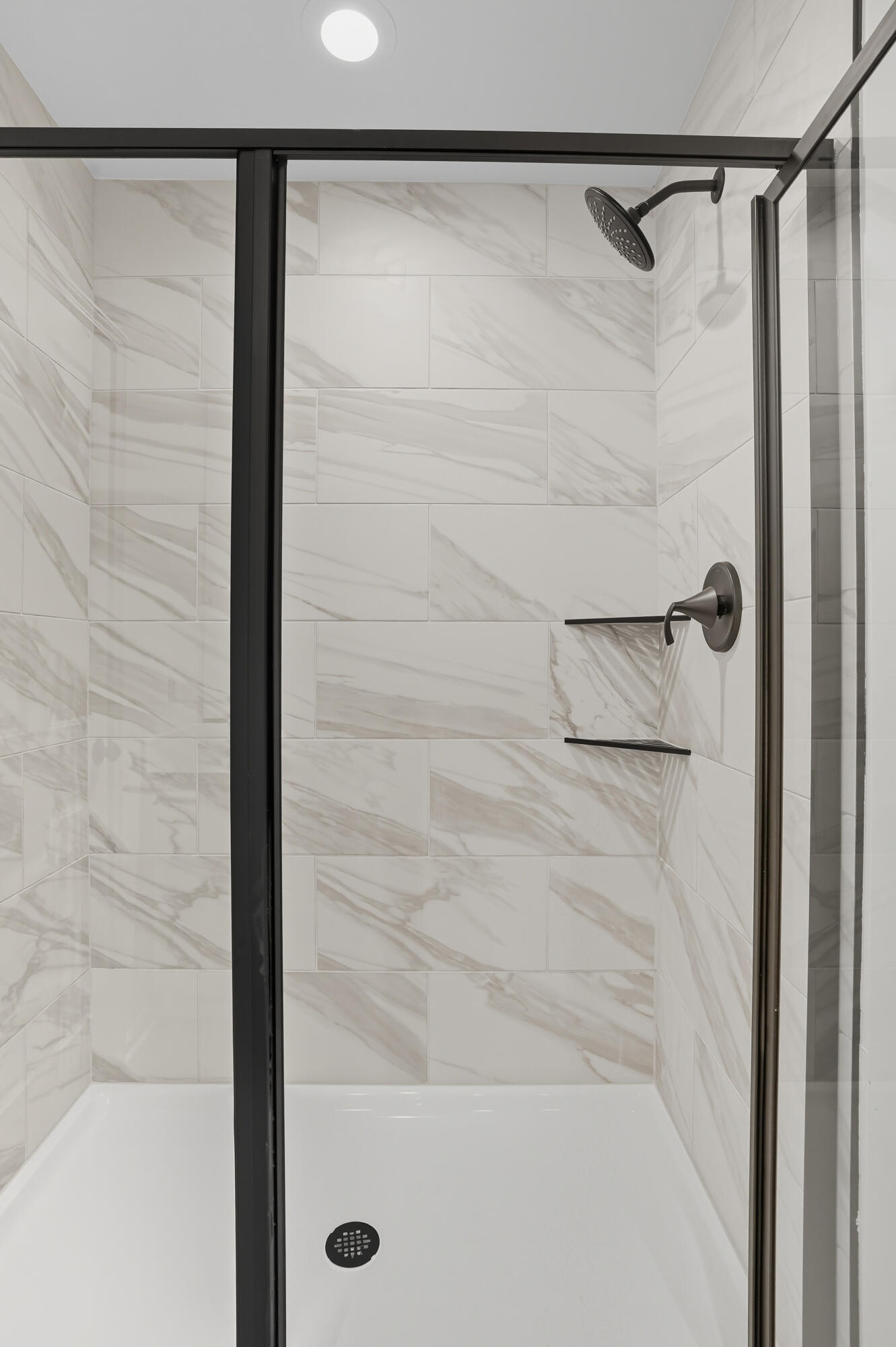 5800 Buck Lane Portage, IN 46368 - Photo 13 of 21 a bathroom with a glass shower door