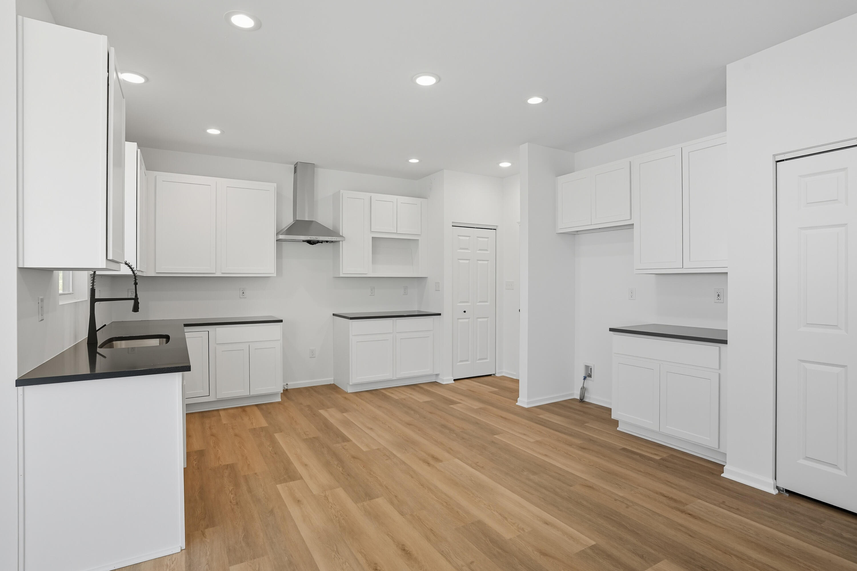 5800 Buck Lane Portage, IN 46368 - Photo 7 of 21 a kitchen with a sink white cabinets and stainless steel appliances