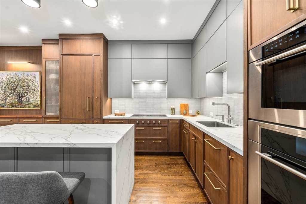 1471 Beacon Street, Unit 5 Brookline, MA 02446 - Photo 13 of 28 a kitchen with a sink refrigerator and microwave