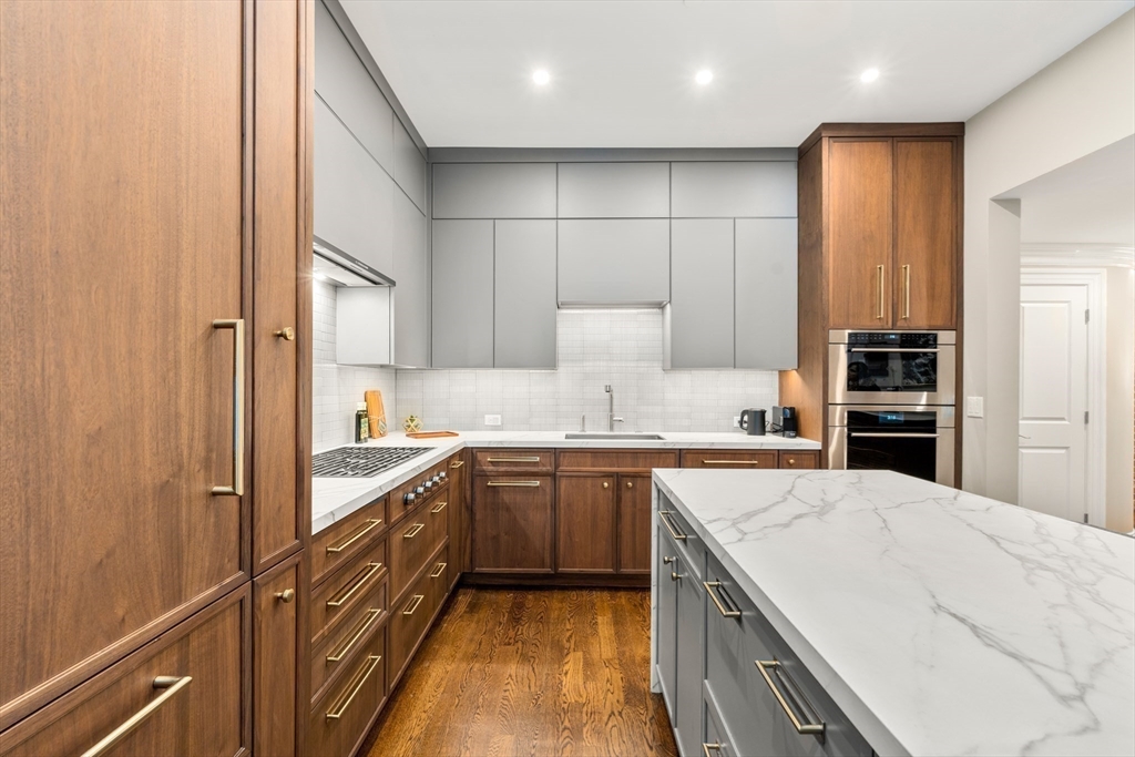 1471 Beacon Street, Unit 5 Brookline, MA 02446 - Photo 14 of 28 a kitchen with a sink stove and refrigerator
