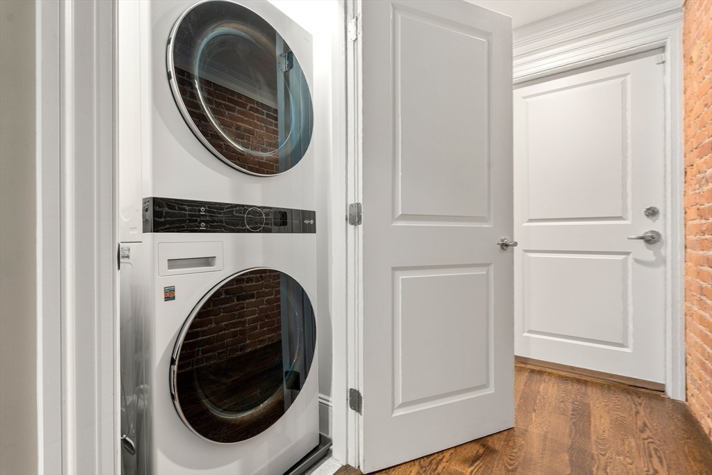 1471 Beacon Street, Unit 5 Brookline, MA 02446 - Photo 24 of 28 a view of a hallway with washer and dryer
