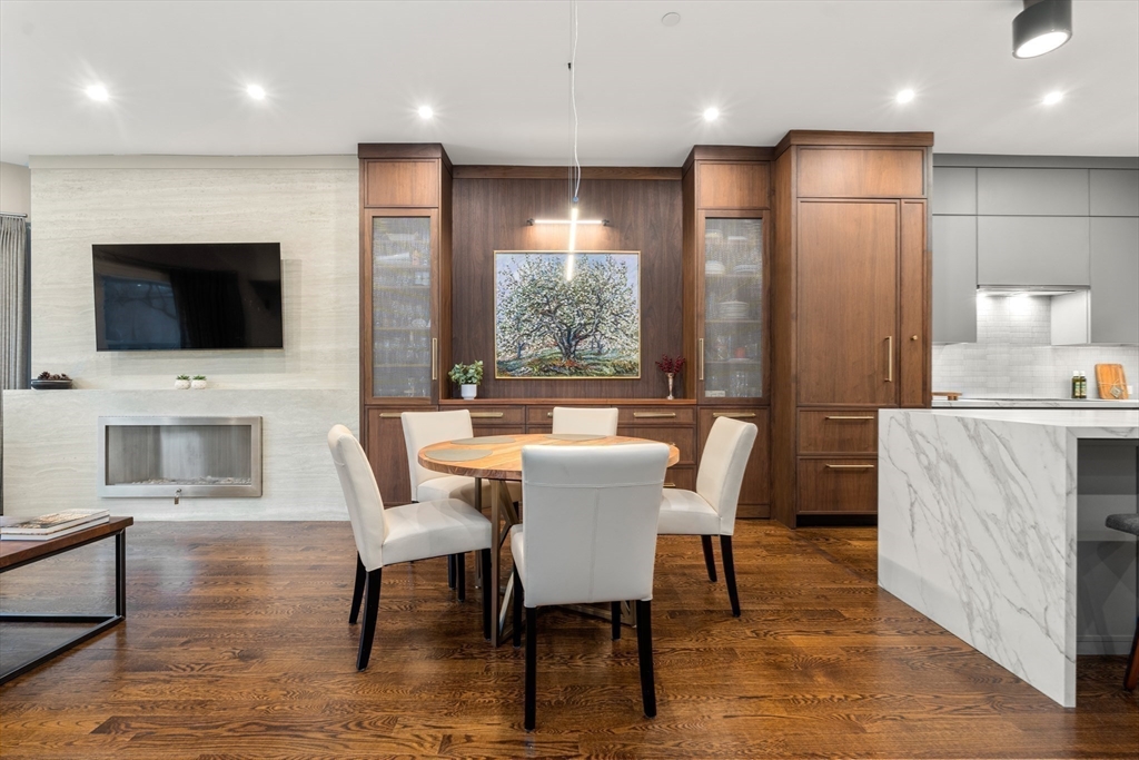 1471 Beacon Street, Unit 5 Brookline, MA 02446 - Photo 7 of 28 a view of a dining room with furniture window and wooden floor
