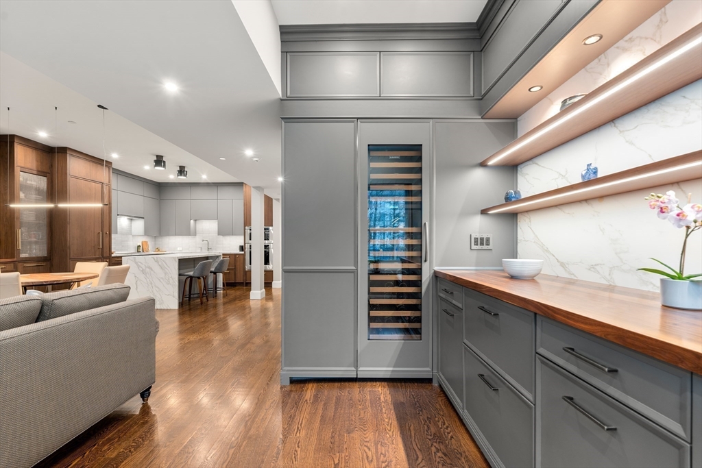 1471 Beacon Street, Unit 5 Brookline, MA 02446 - Photo 10 of 28 a kitchen with stainless steel appliances granite countertop a refrigerator and a stove top oven