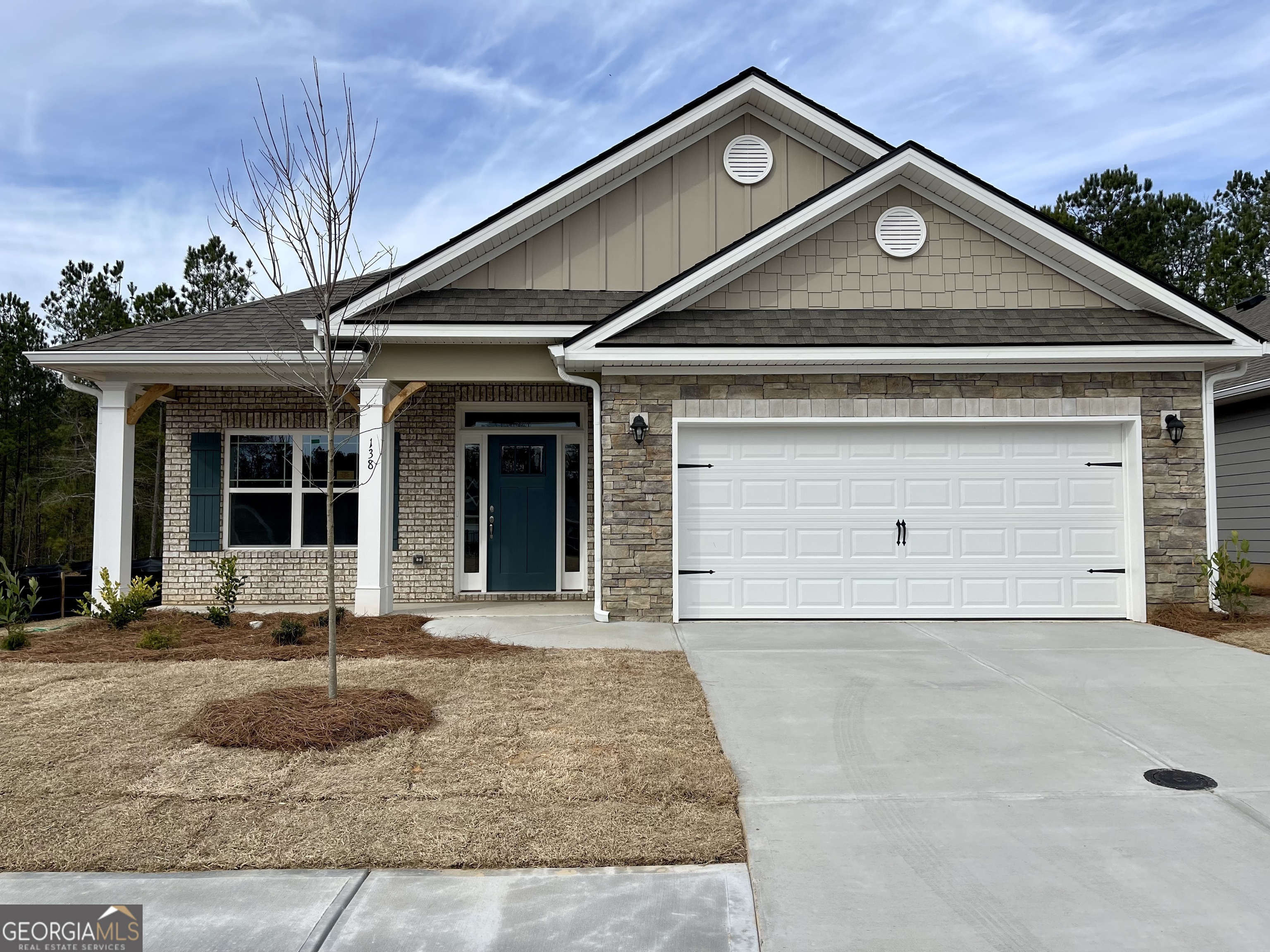 138 Windmill Way, Unit 20 Carrollton, GA 30117 - Photo 1 of 1 a front view of a house with garden