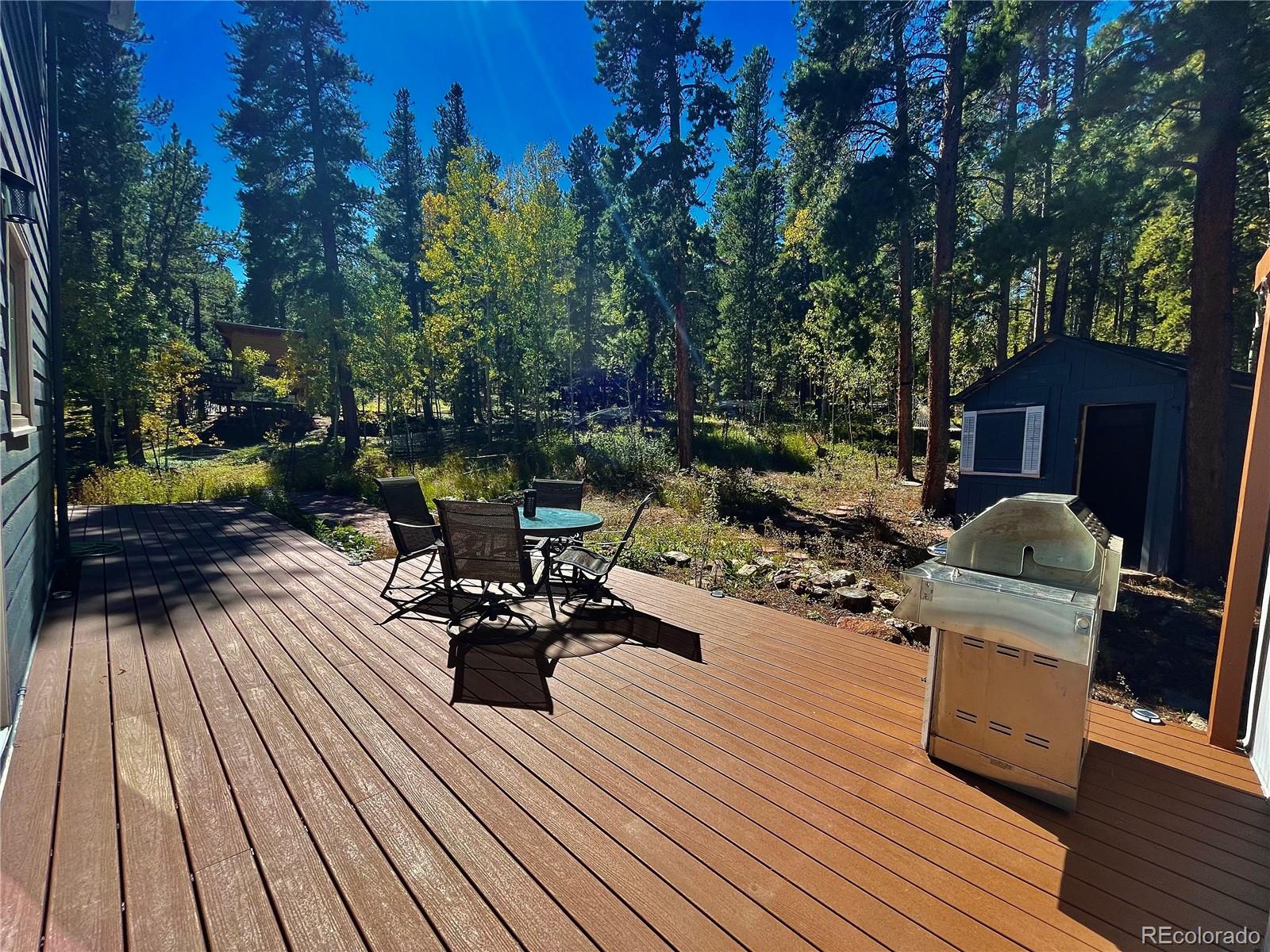 265 Caesar Road Black Hawk, CO 80422 - Photo 40 of 42 a view of a chairs and table on the wooden floor