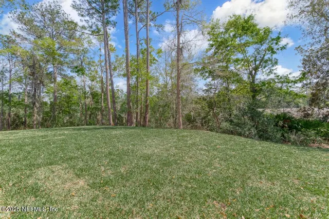a view of a kitchen with stainless steel appliances