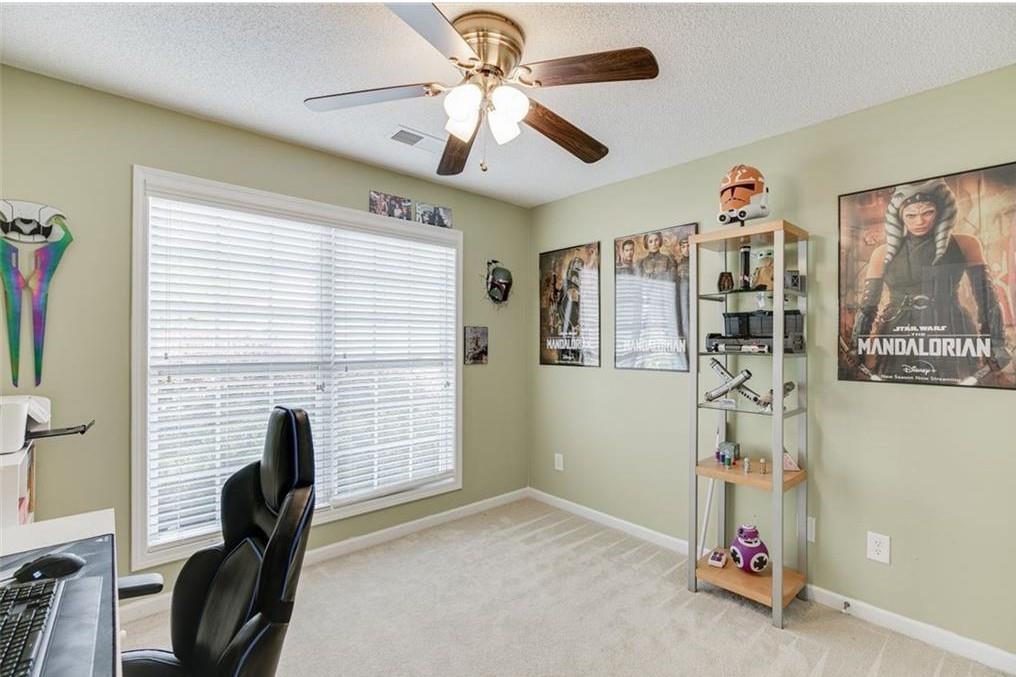 1281 Key Manor Lane Lawrenceville, GA 30045 - Photo 14 of 22 a view of a workspace with furniture and a window