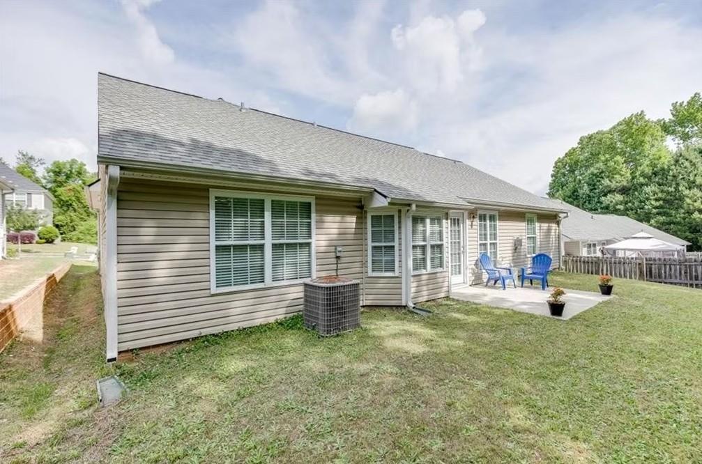 1281 Key Manor Lane Lawrenceville, GA 30045 - Photo 20 of 22 a view of a house with a backyard and porch