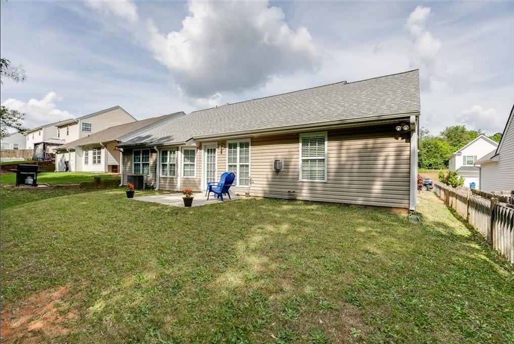 1281 Key Manor Lane Lawrenceville, GA 30045 - Photo 21 of 22 a view of a house with a backyard