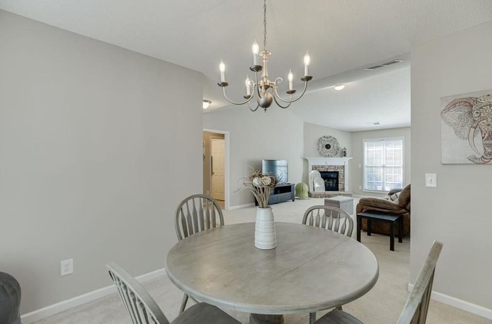 1281 Key Manor Lane Lawrenceville, GA 30045 - Photo 6 of 22 a view of a dining room with furniture