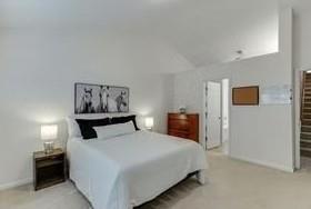 1281 Key Manor Lane Lawrenceville, GA 30045 - Photo 8 of 22 a bedroom with a bed and cupboard