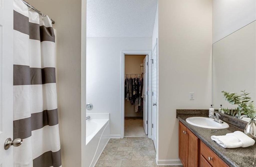 1281 Key Manor Lane Lawrenceville, GA 30045 - Photo 10 of 22 a bathroom with a sink and a mirror