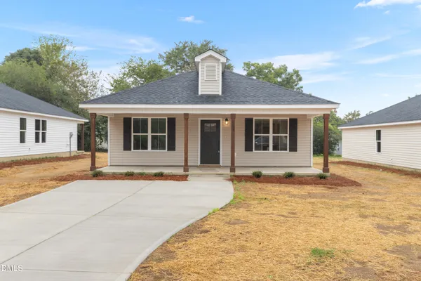 front view of a house with a swimming pool