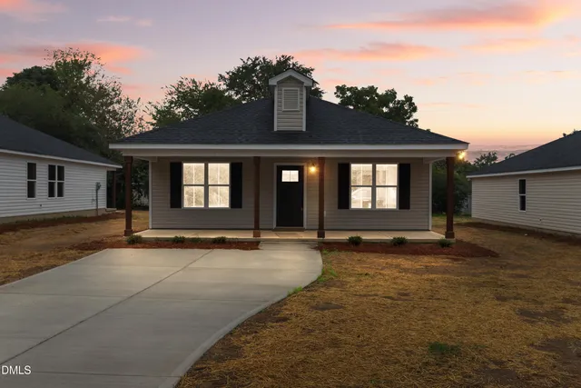 front view of a house with a yard