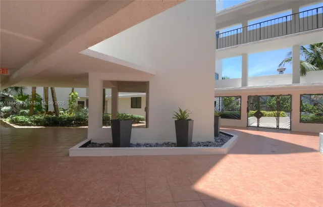 a view of a house with backyard and porch