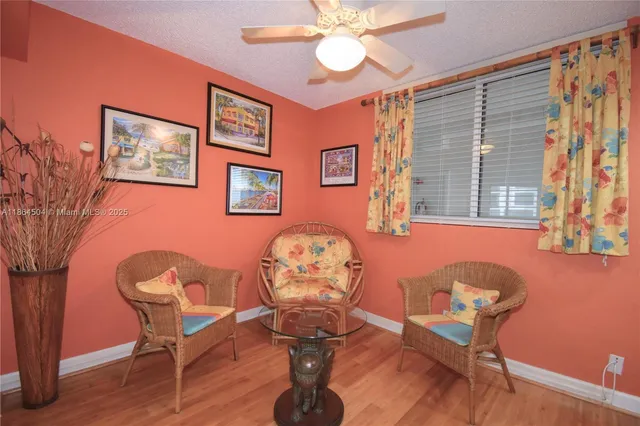 a living room with furniture a table and chair