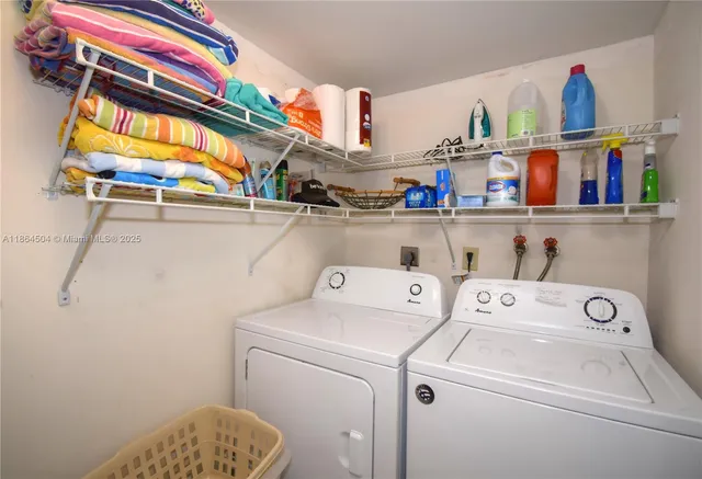 a view of a terrace with a table and chairs and potted plants