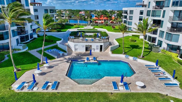 a view of yard with swimming pool and outdoor seating
