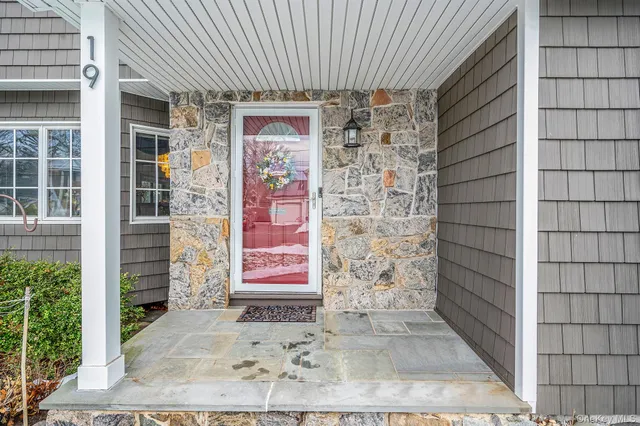 a front view of a house with a door and a window