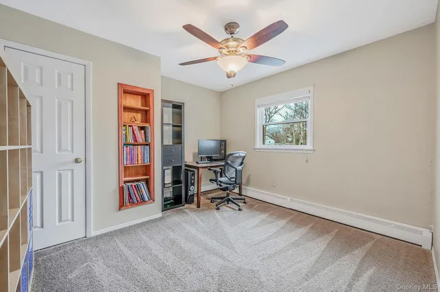 a workspace with furniture and a window