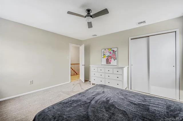 a bedroom with a bed dresser and a furniture