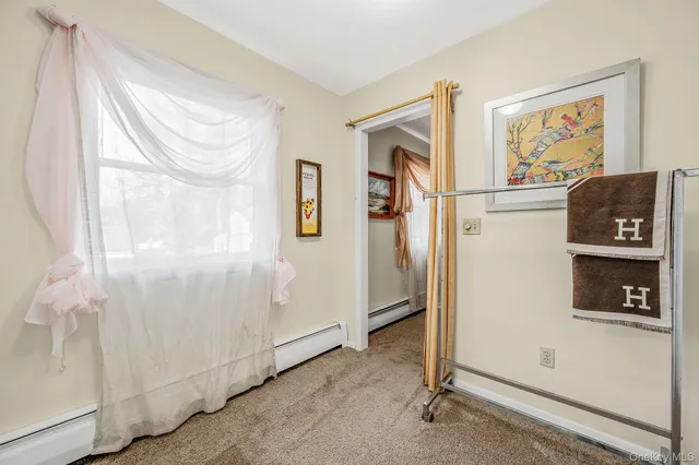 a view of a hallway with paintings on the wall