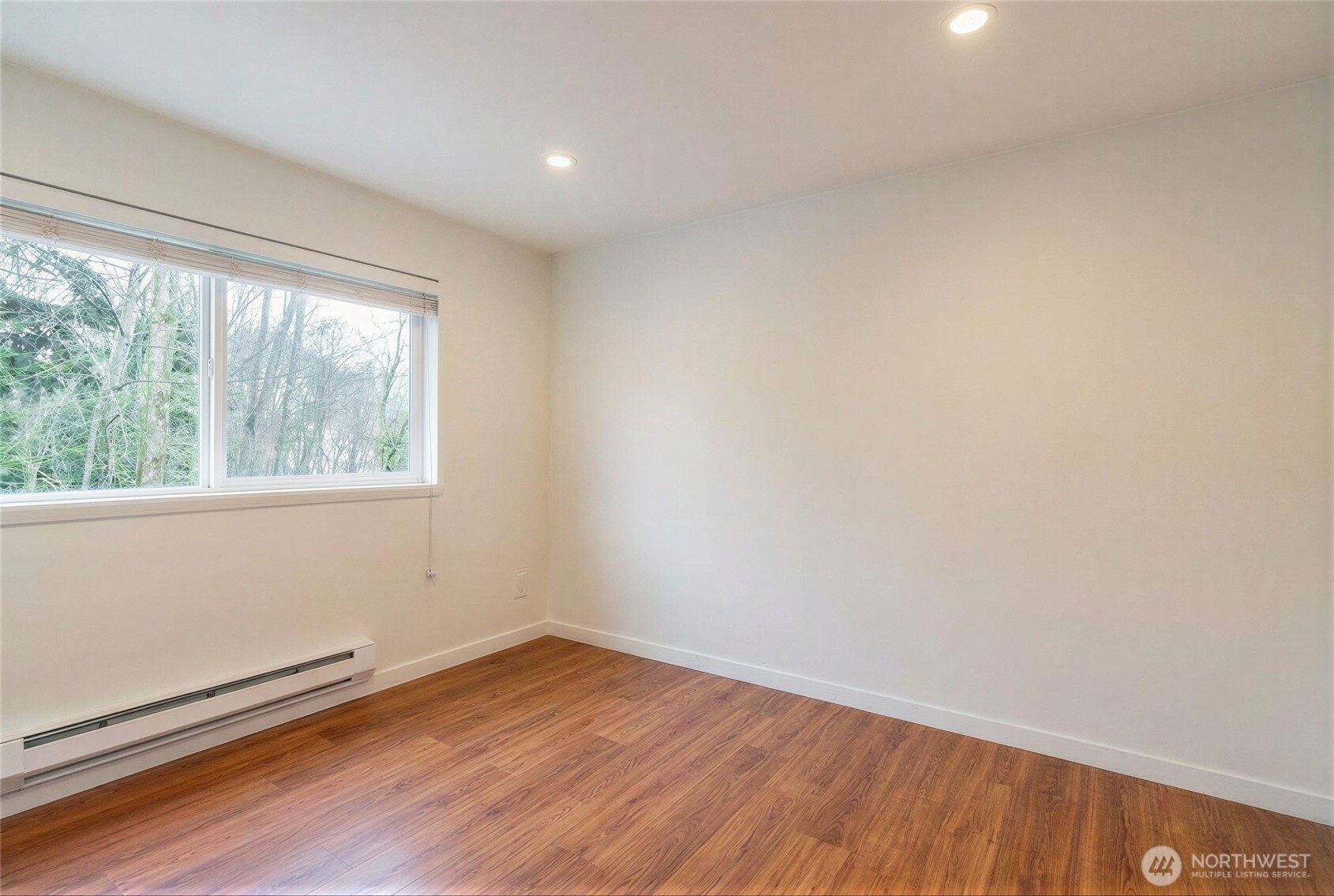 975 Aberdeen Avenue Northeast, Unit F207 Renton, WA 98056 - Photo 16 of 24 wooden floor in an empty room with a window