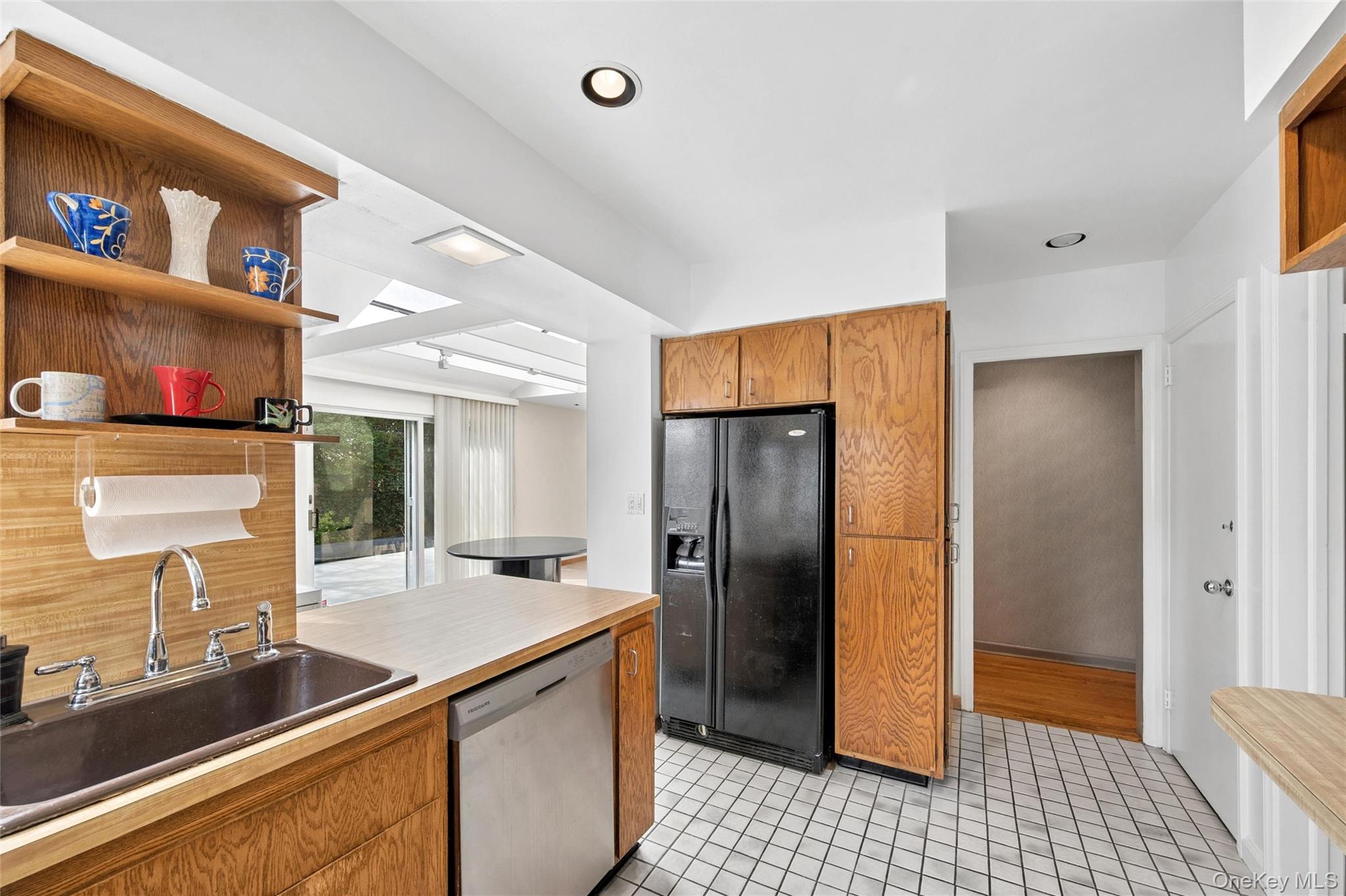 24 Allen Road Rockville Centre, NY 11570 - Photo 11 of 46 a kitchen with stainless steel appliances granite countertop a refrigerator and a sink