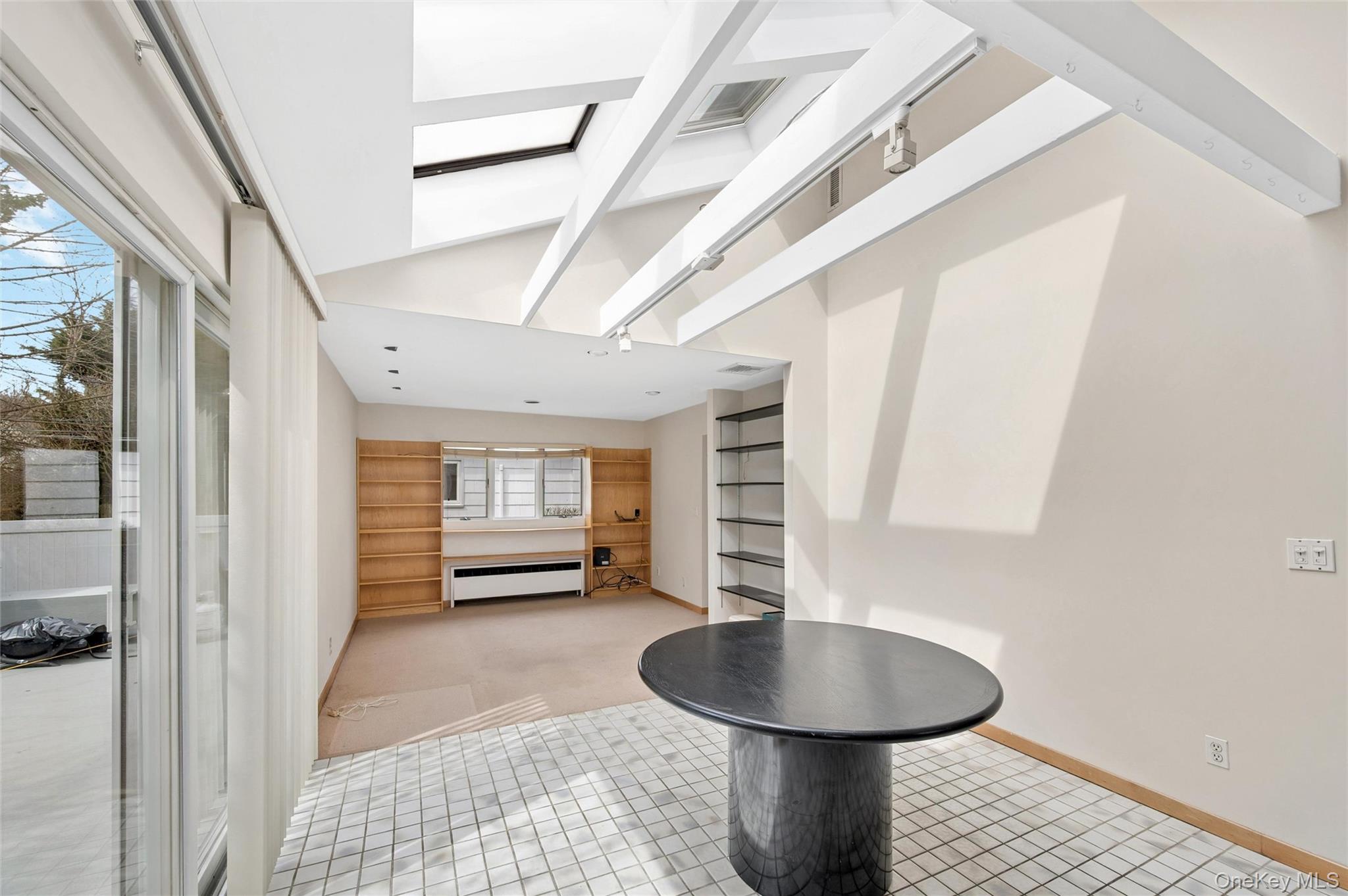 24 Allen Road Rockville Centre, NY 11570 - Photo 15 of 46 a bathroom with a sink a toilet and a mirror