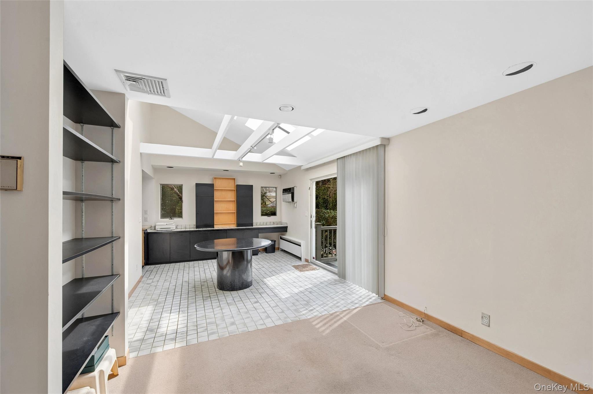 24 Allen Road Rockville Centre, NY 11570 - Photo 16 of 46 a view of a patio with a table and chairs