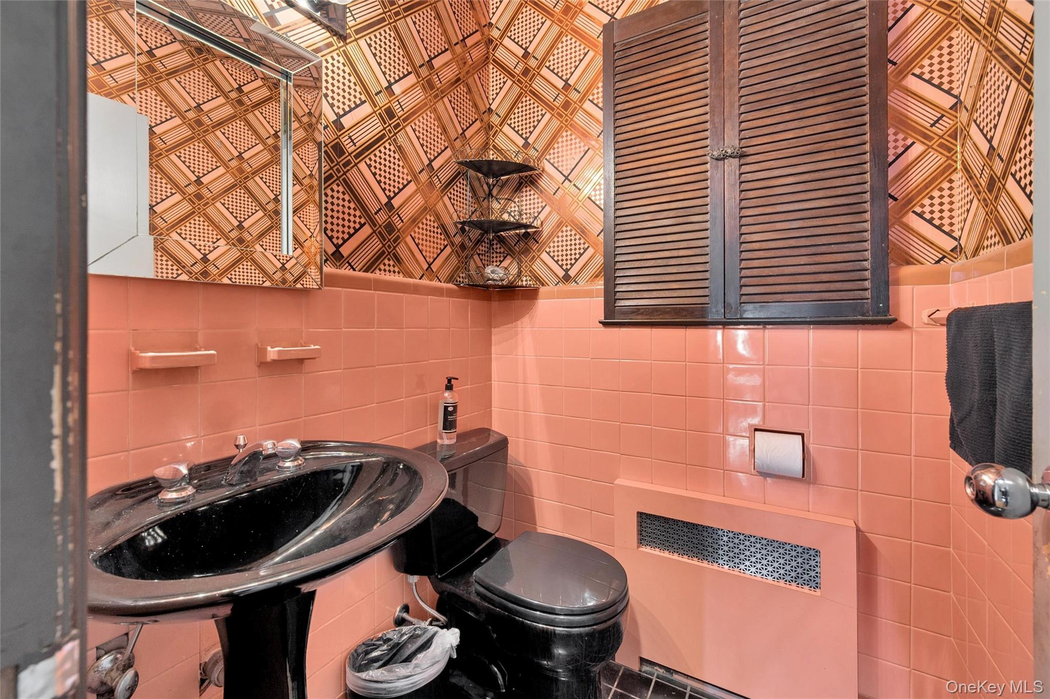 24 Allen Road Rockville Centre, NY 11570 - Photo 20 of 46 a bathroom with a toilet and a sink