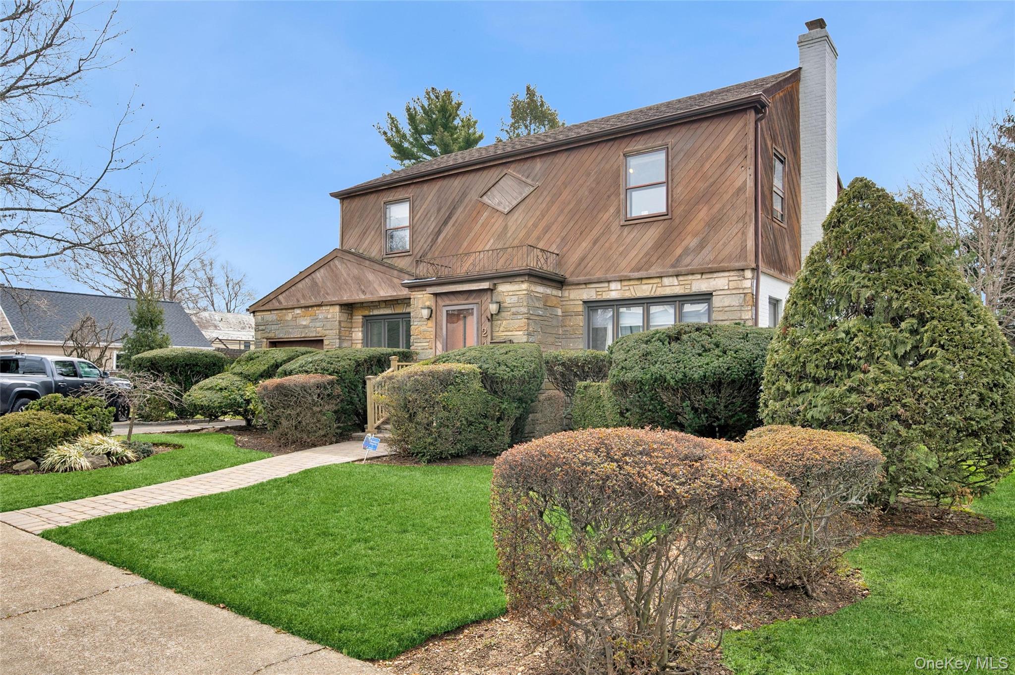 24 Allen Road Rockville Centre, NY 11570 - Photo 2 of 46 a front view of a house with a yard