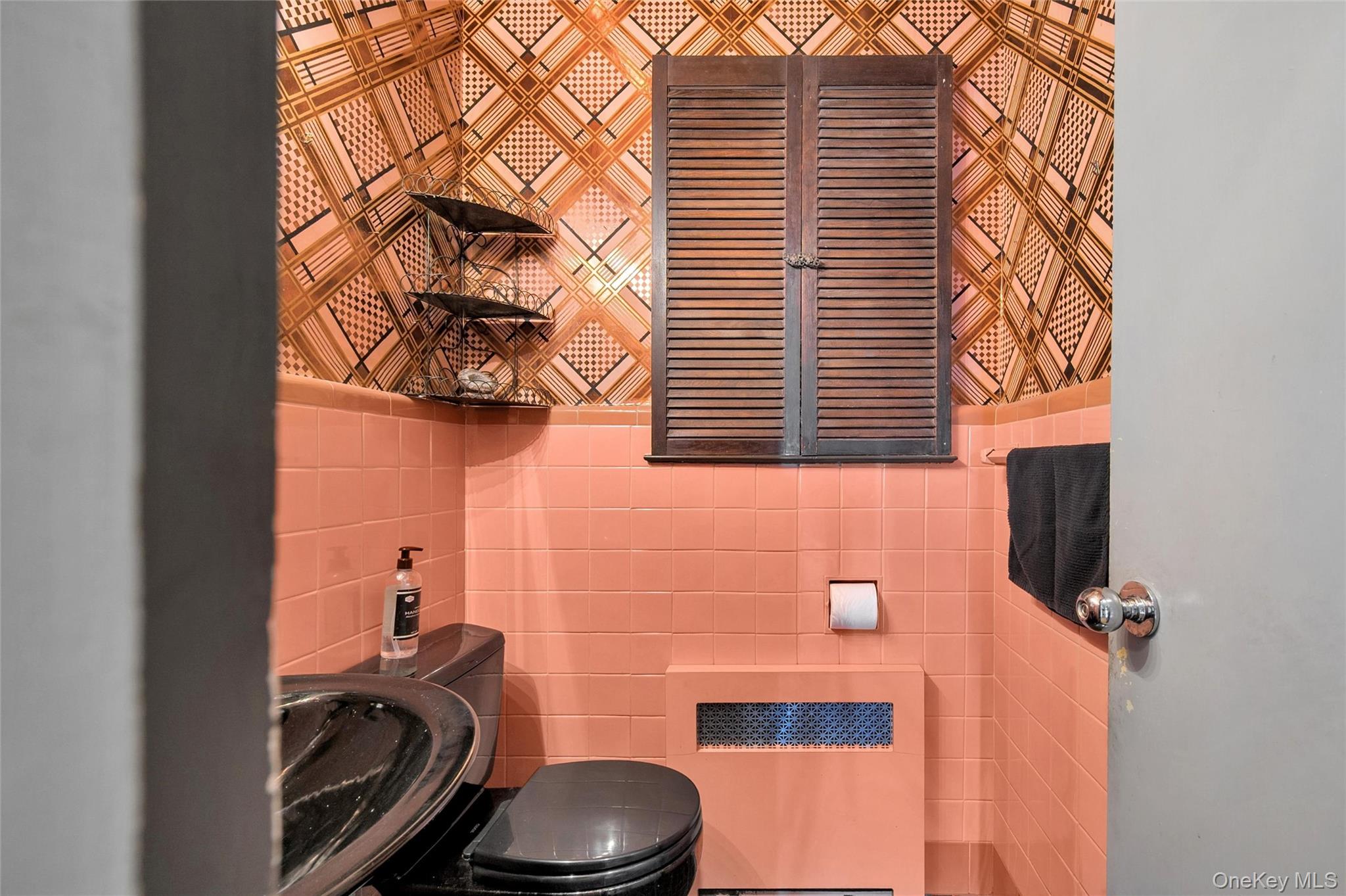 24 Allen Road Rockville Centre, NY 11570 - Photo 21 of 46 a bathroom with a sink and a toilet