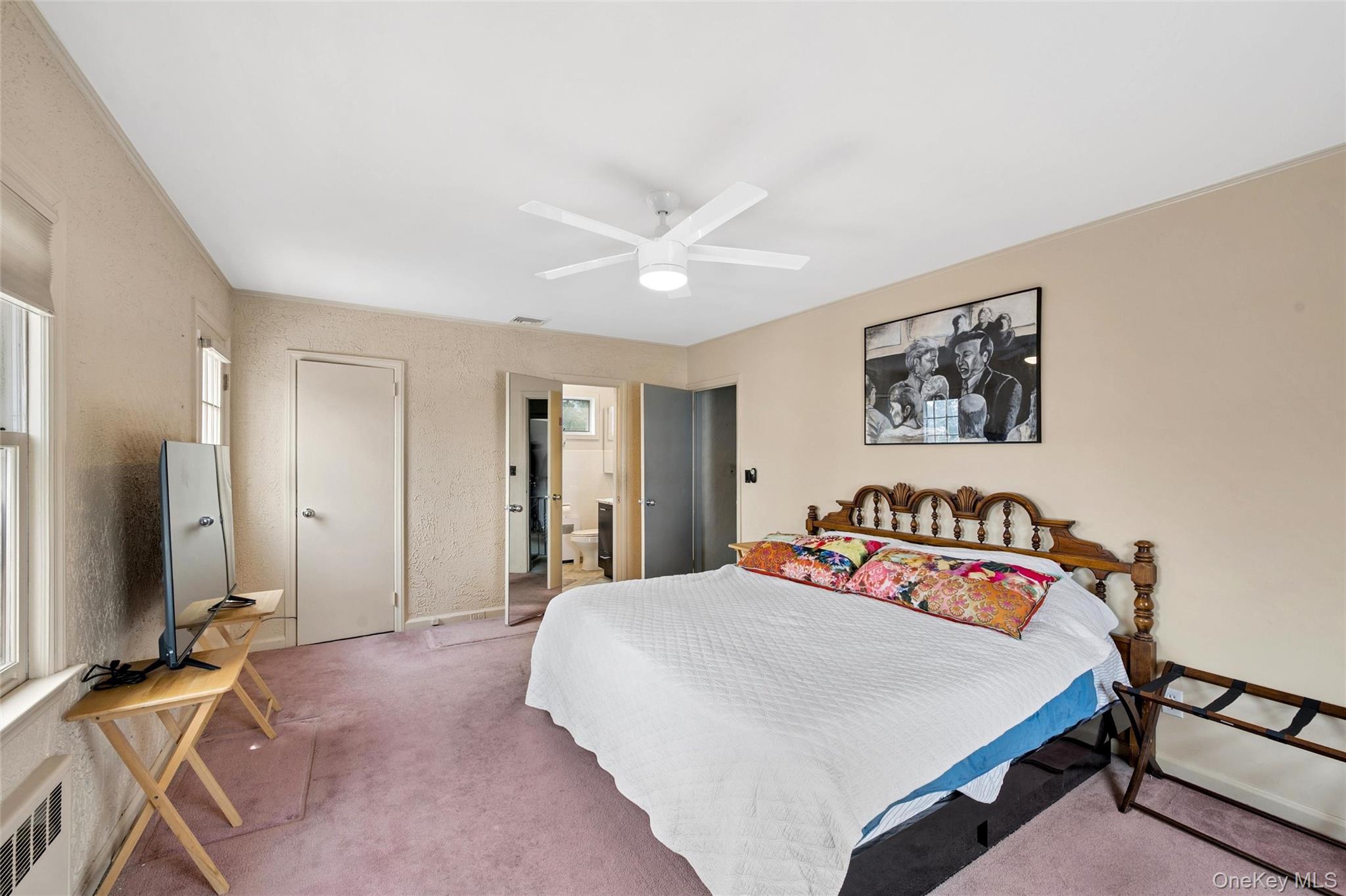 24 Allen Road Rockville Centre, NY 11570 - Photo 24 of 46 a bedroom with a bed and a flat screen tv